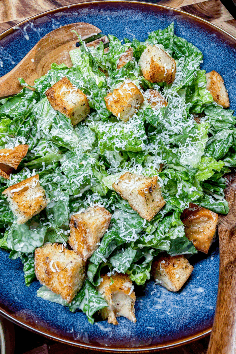 caesar salad with parmesan cheese and croutons
