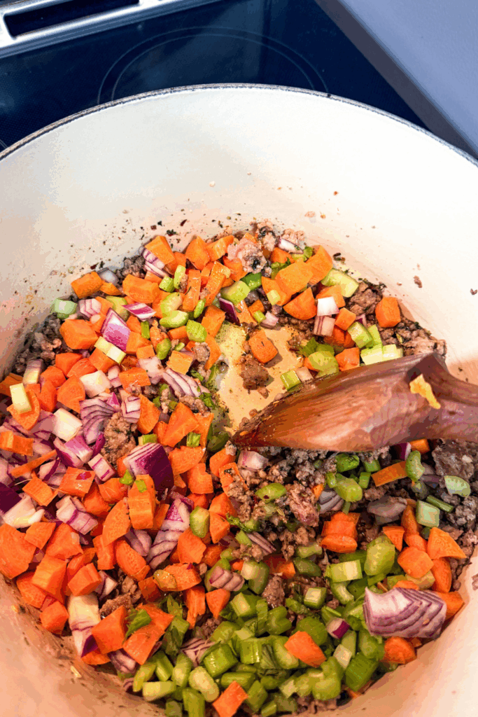 veggies cooking with meat and seasoning