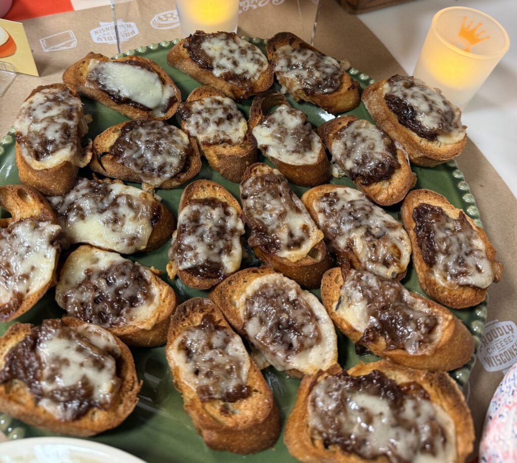 image of the finished French onion crostini on a platter.