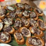 image of the finished French onion crostini on a platter.