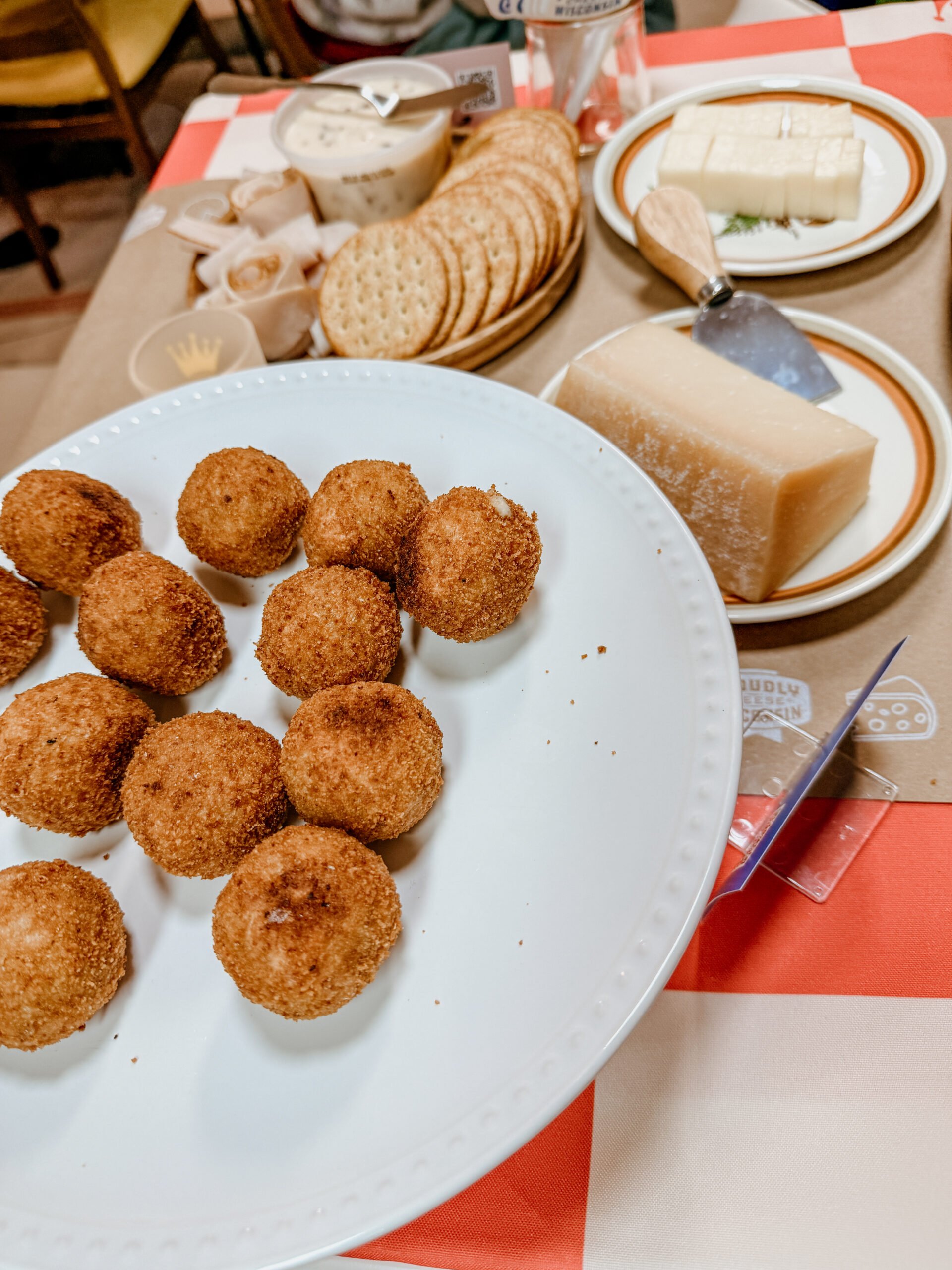 finished arancini on a plate.