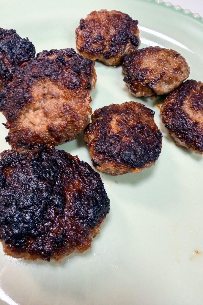 Pan-fried homemade breakfast sausage patties with a crispy golden exterior
