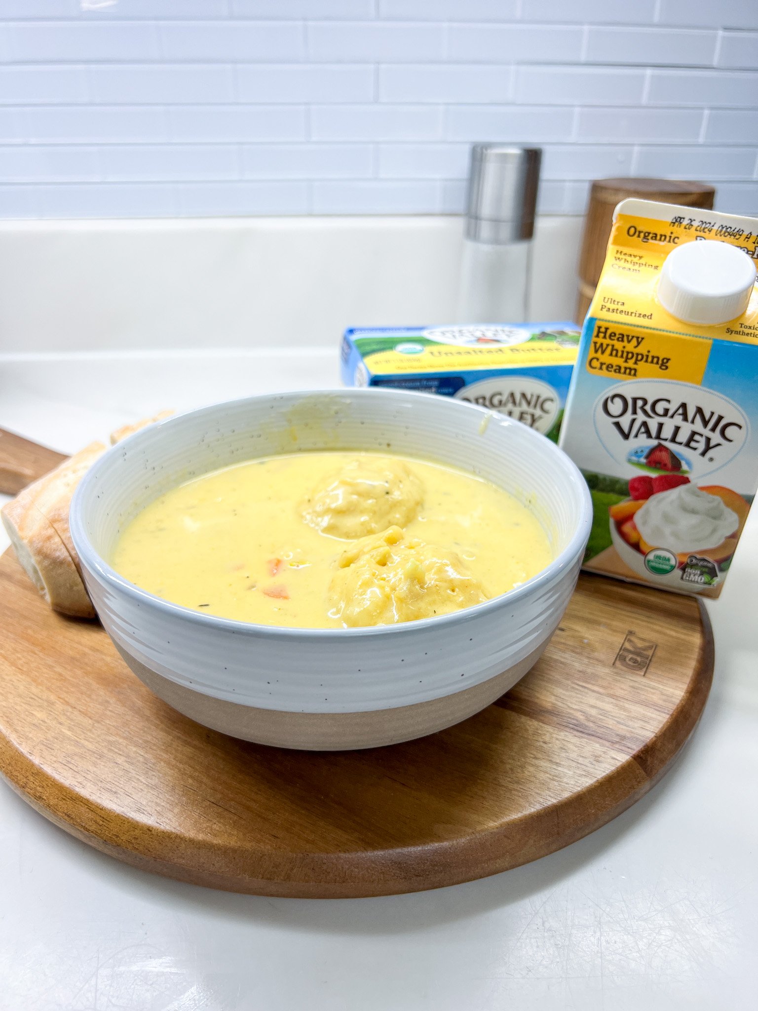 Creamy homemade chicken and dumplings with fluffy dumplings and vegetables in rich broth