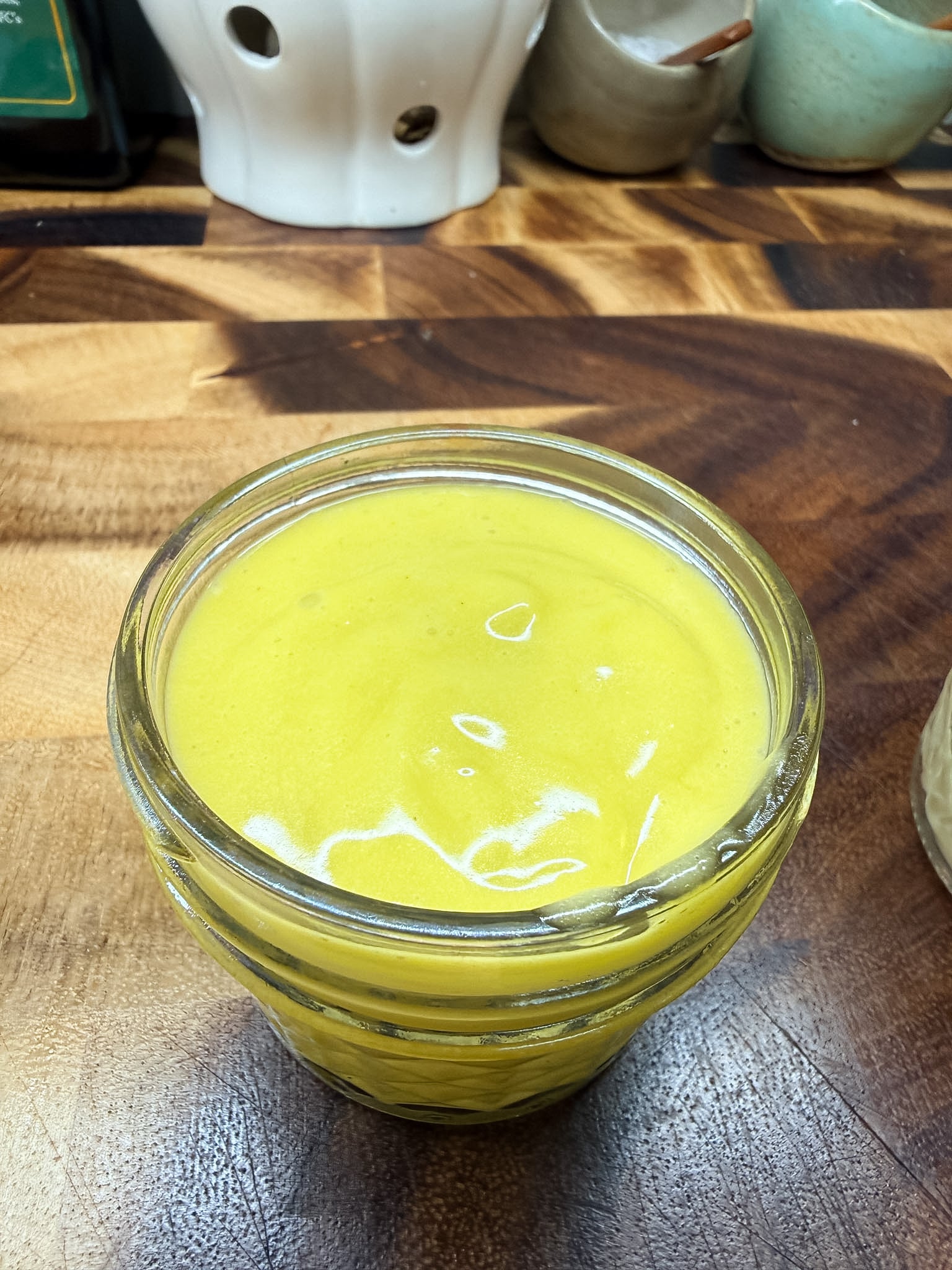Garlic aioli whisked by hand in glass jar