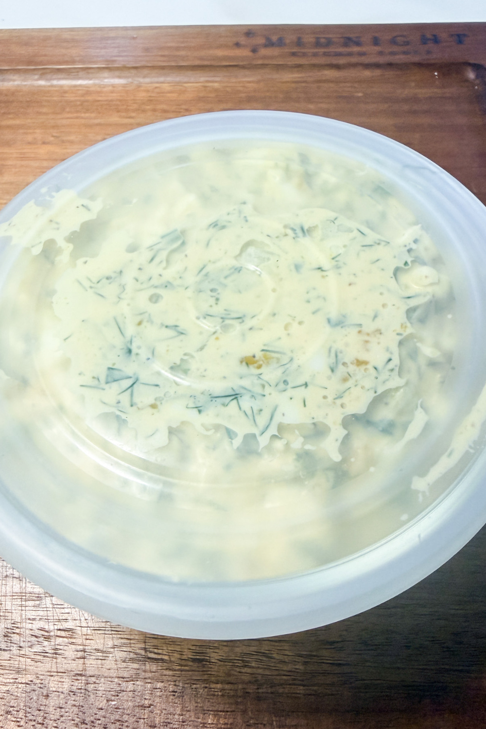 Egg salad stored in a bowl covered with reusable silicone lid