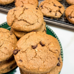 Peanut butter oatmeal breakfast cookies stacked on a plate with chocolate chips