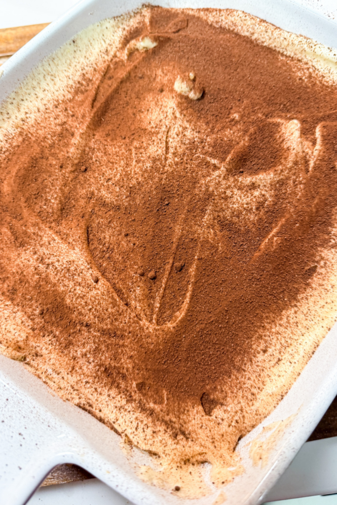 Tiramisu dusted with cocoa powder before chilling