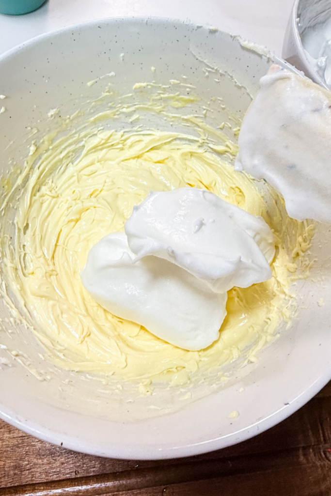 Mascarpone cheese mixture being prepared for tiramisu filling