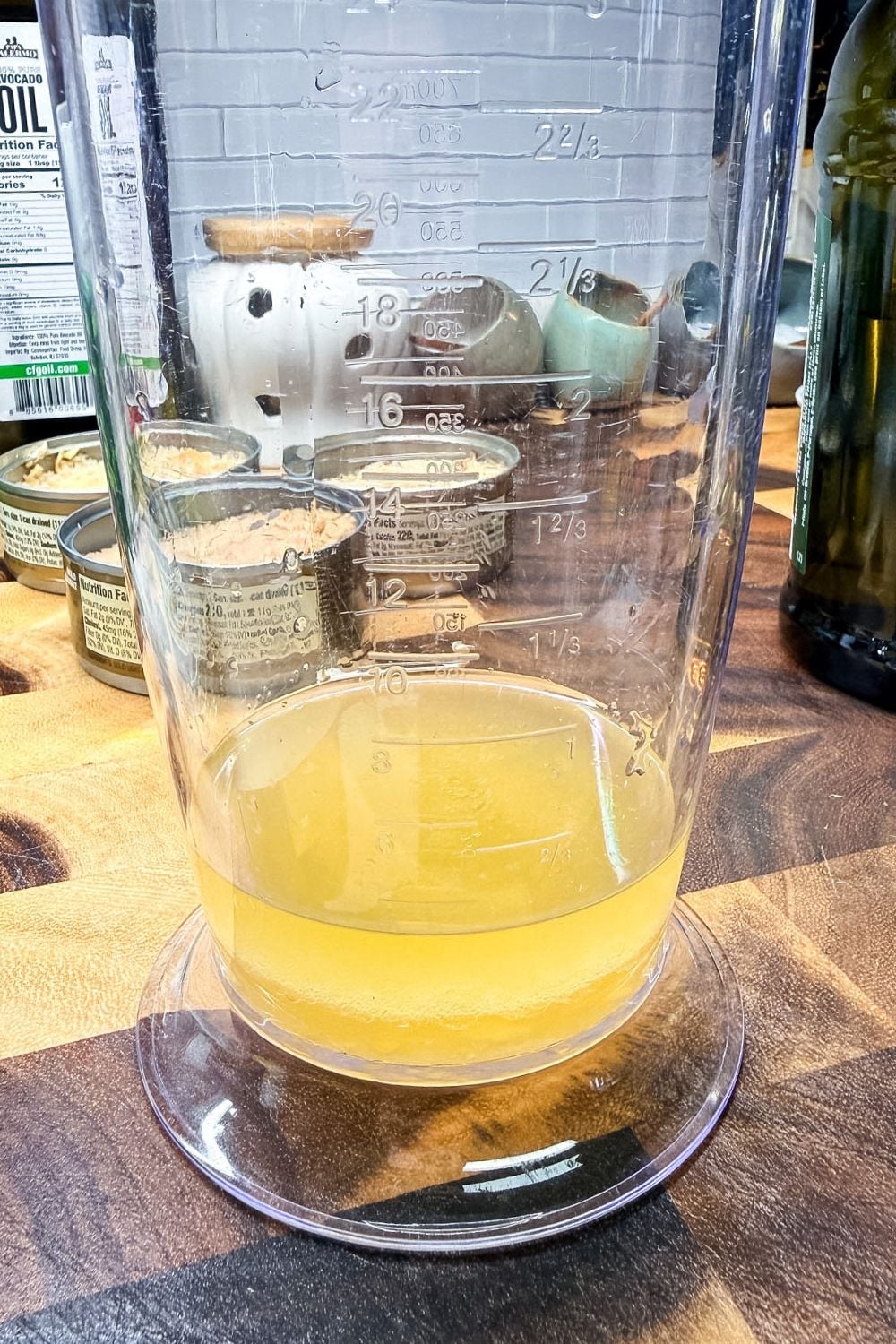Tuna oil drained into a measuring cup to use for homemade mayonnaise