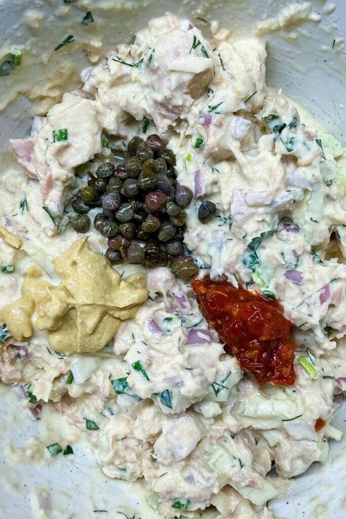 Capers, mustard, and chili garlic sauce added to tuna salad for flavor
